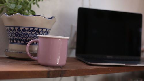 Close-up of coffee cup on table