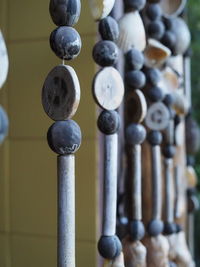 Close-up of chain hanging on wood