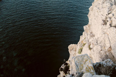 High angle view of rock formation at sea