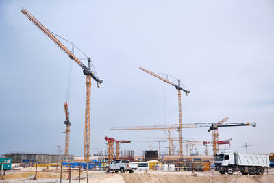Low angle view of electricity pylon against clear sky