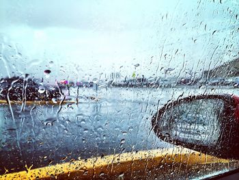 Full frame shot of wet window on car