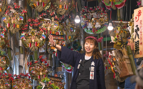 Woman standing at market stall