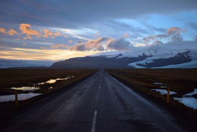 Road against dramatic sky during winter