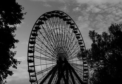 Low angle view of ferris wheel against sky