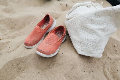 High angle view of shoes on sand