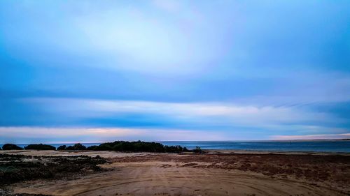 Scenic view of beach against sky