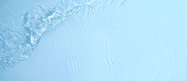 Transparent blue clear calm water surface wave texture