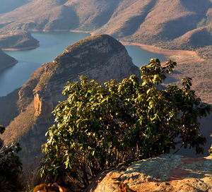 Scenic view of sea and mountains against sky