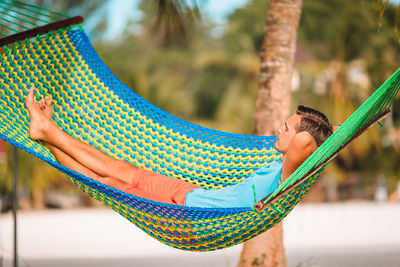 Man relaxing on hammock