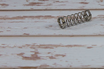 High angle view of metallic object on table