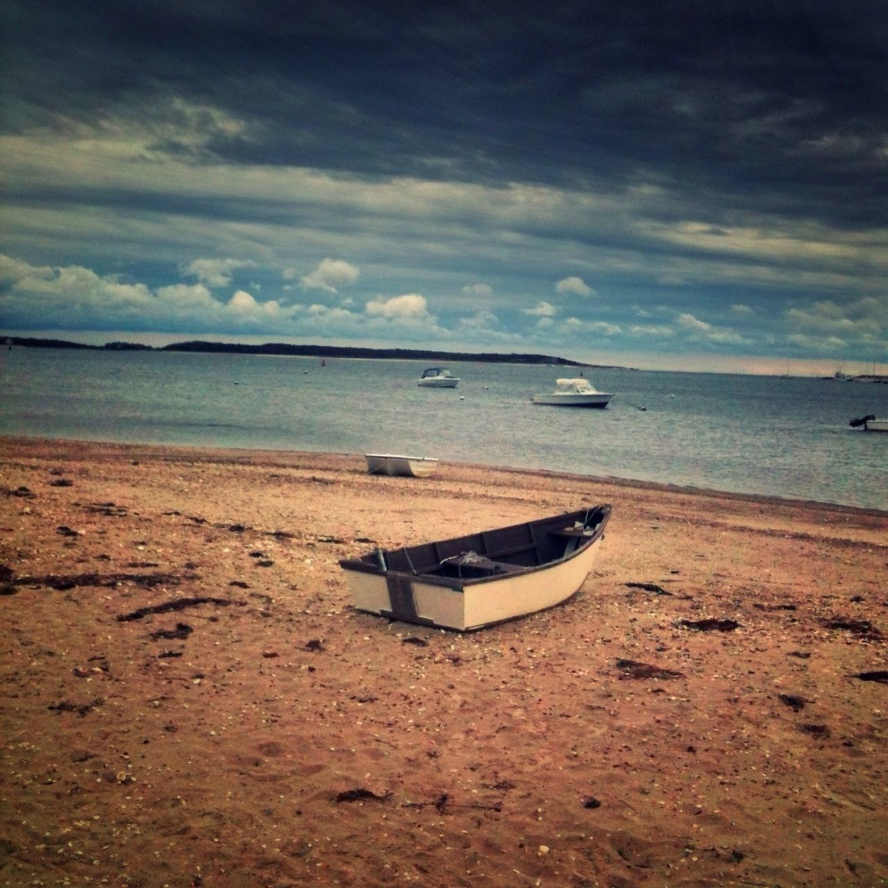 sea, beach, sky, water, horizon over water, shore, sand, cloud - sky, tranquility, tranquil scene, transportation, scenics, nautical vessel, beauty in nature, boat, cloudy, mode of transport, nature, cloud, idyllic