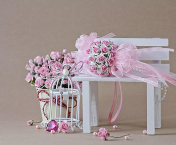 Pink flower vase on table
