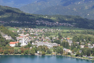 Aerial view of townscape by mountains