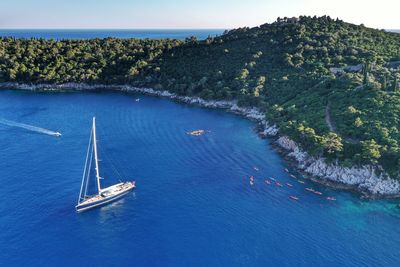 High angle view of sailboat sailing in sea against sky