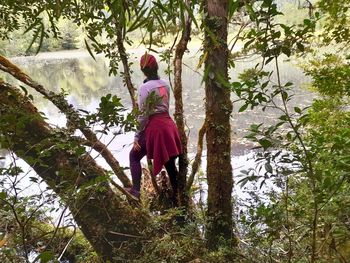 Rear view of woman in forest