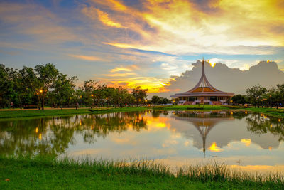 Scenic view of lake against orange sky