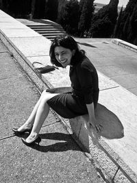 Portrait of woman sitting on floor