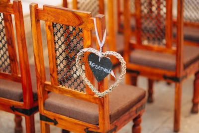 Close-up of orange hanging on chair