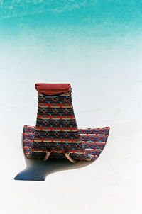 Close-up of hat on floor against white background