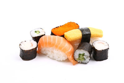 Close-up of sushi against white background