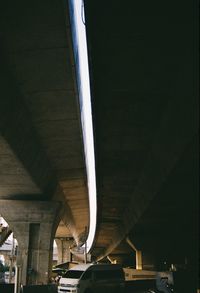 Low angle view of bridge over road in city