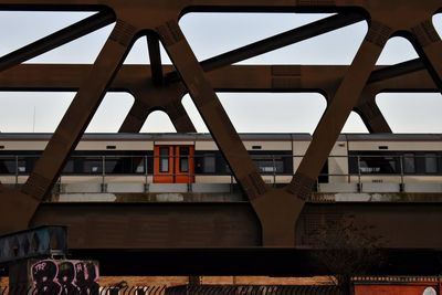 Low angle view of railway bridge against sky