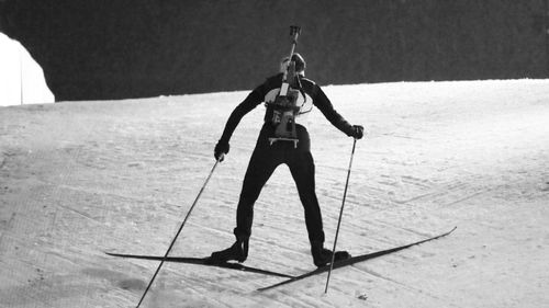 Full length of man standing on snow covered land