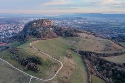 High angle view of road by land against sky