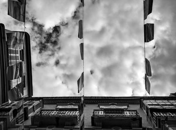 Low angle view of building against cloudy sky