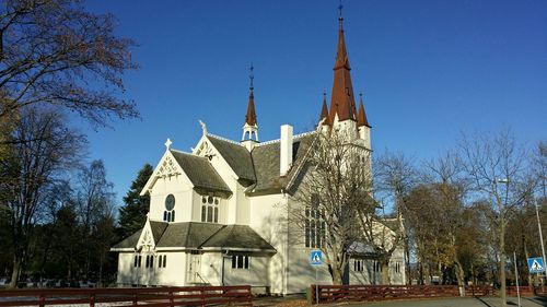 High angle view of church against blue sky