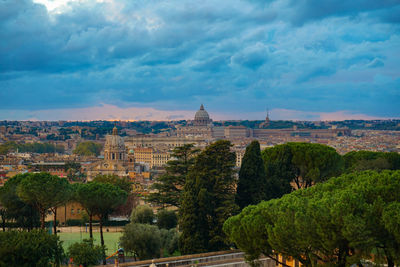 Panoramic view of trees and buildings against sky