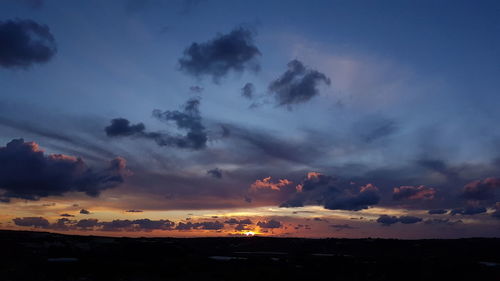 Low angle view of dramatic sky at sunset