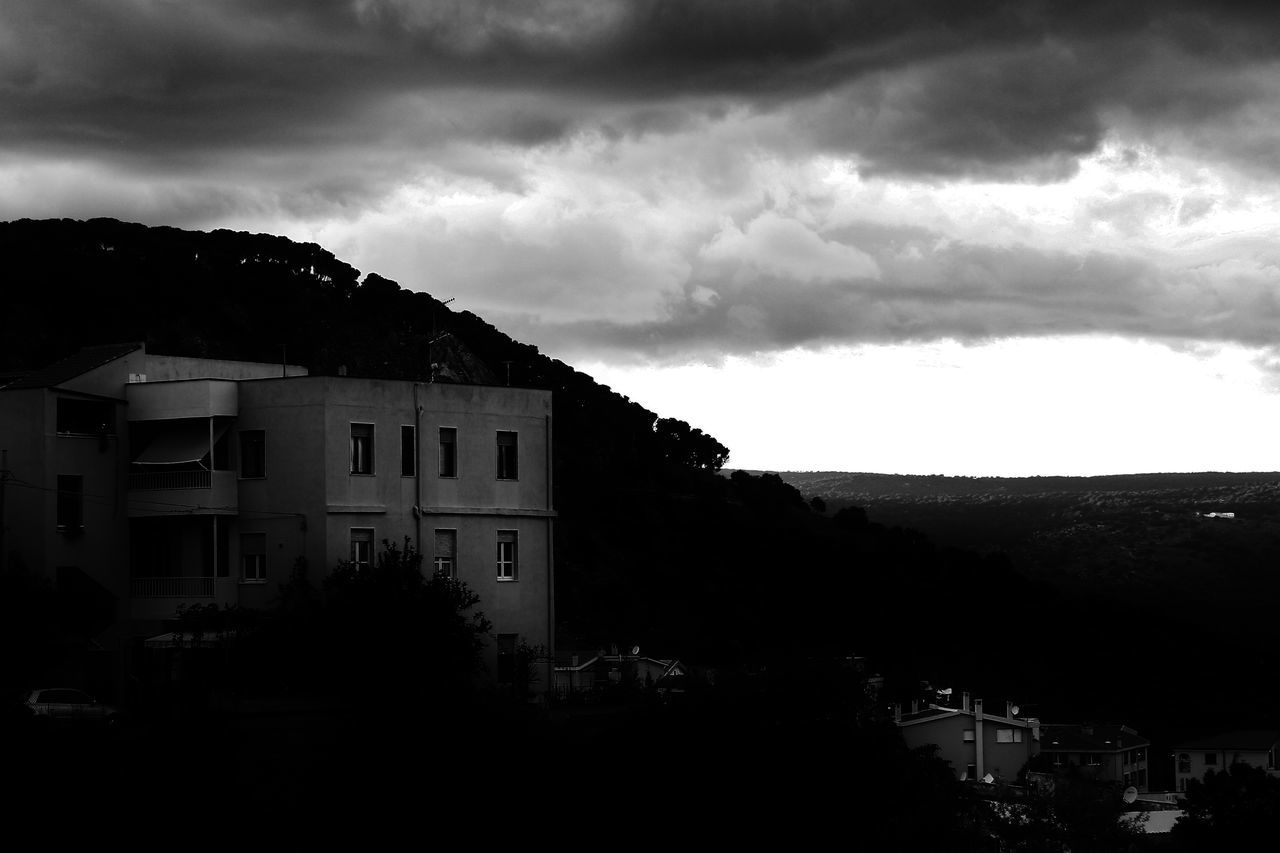 BUILDINGS AGAINST SKY AT DUSK