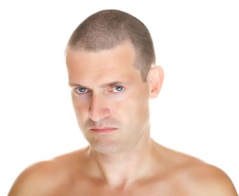 Portrait of young man against white background