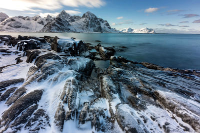 Scenic view of frozen lake against sky