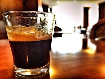 Close-up of beer glass on table