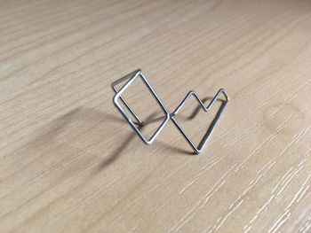 High angle view of paper clip on table