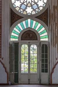 Exterior of historic building seen through glass window