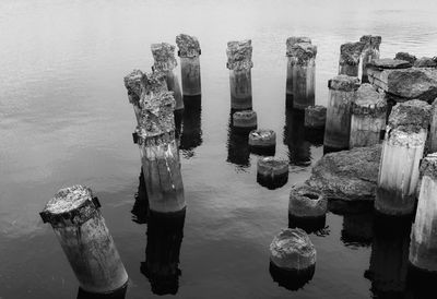 High angle view of damaged wooden post in river