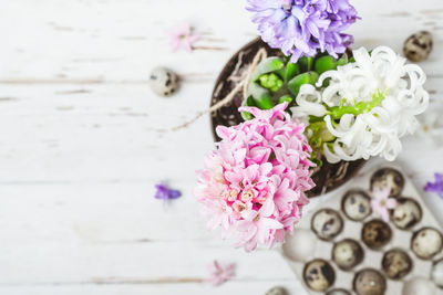 Close-up of pink flower vase on table