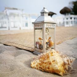 Shell candle sand beach decor wedding details