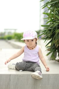 Portrait of girl sitting outdoors