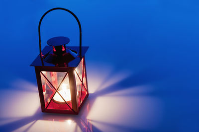 High angle view of illuminated lantern on floor