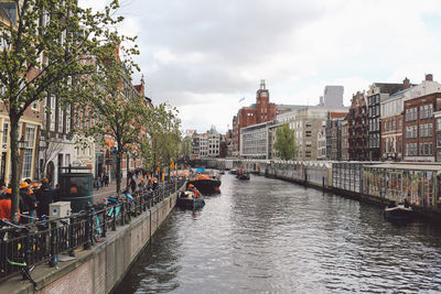 Canal amidst buildings