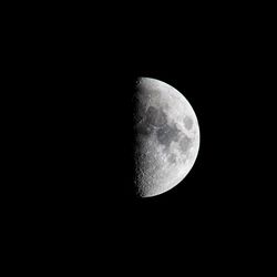 Low angle view of moon against sky at night