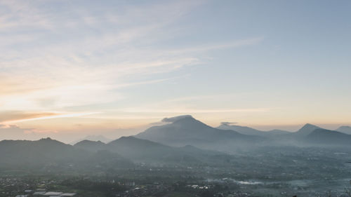 Scenic view of mountains against sky during sunset
