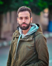 Portrait of young man standing outdoors