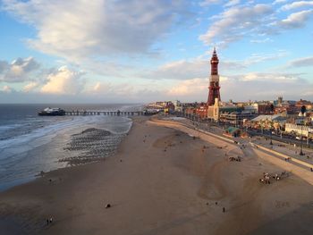 View of beach against cloudy sky