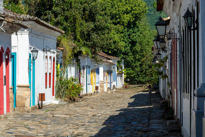 Footpath amidst historic buildings in city