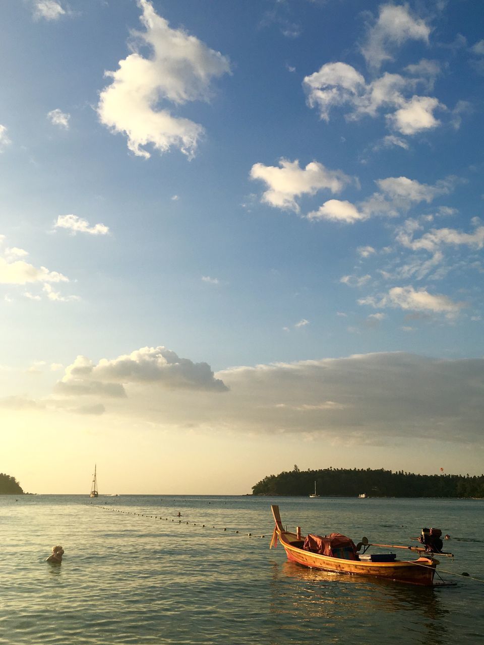 nautical vessel, transportation, mode of transport, boat, water, sea, sky, waterfront, cloud - sky, tranquil scene, tranquility, scenics, nature, moored, beauty in nature, sailing, horizon over water, travel, sailboat, cloud